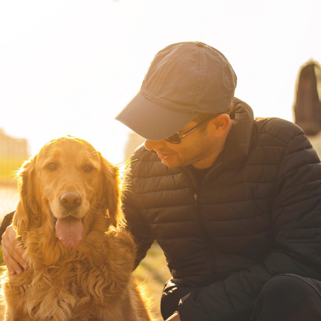 Man with golden retriever