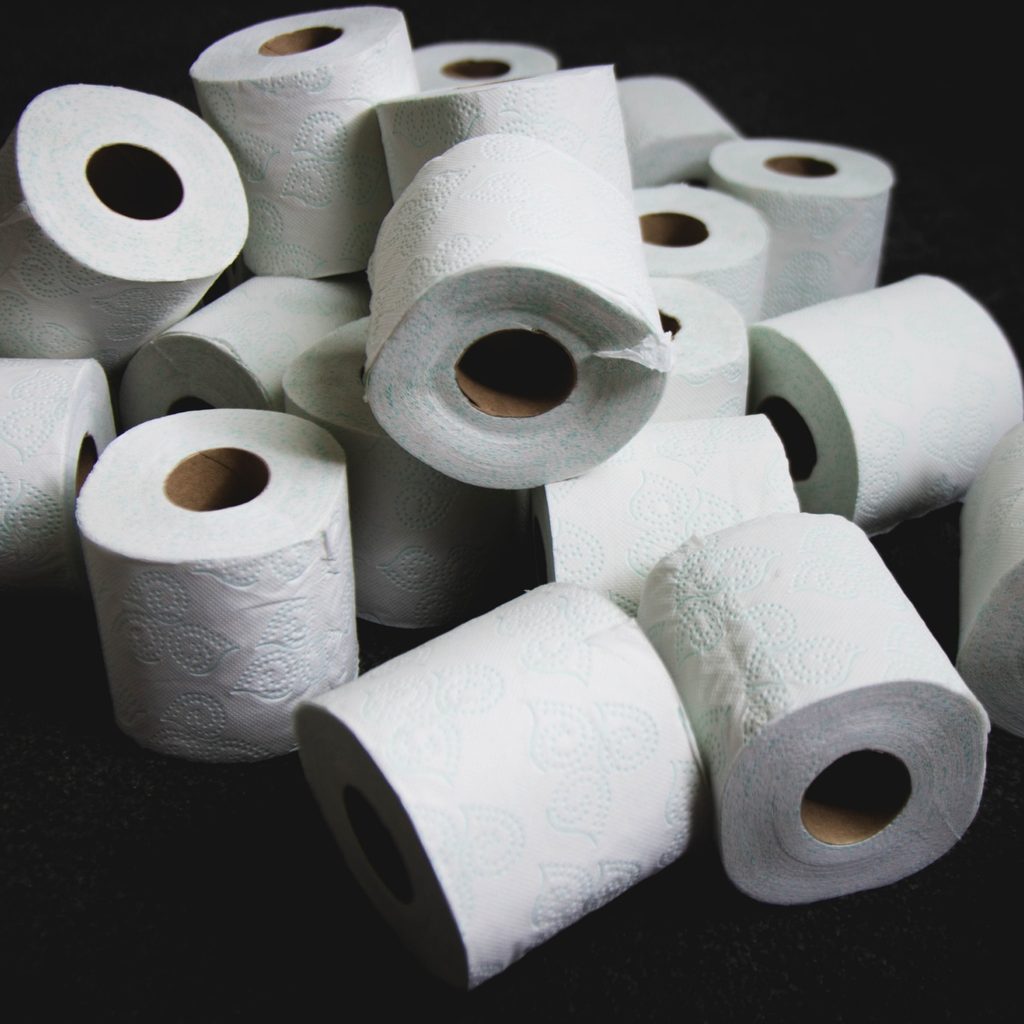 White Tissue Paper Rolls on Black Table