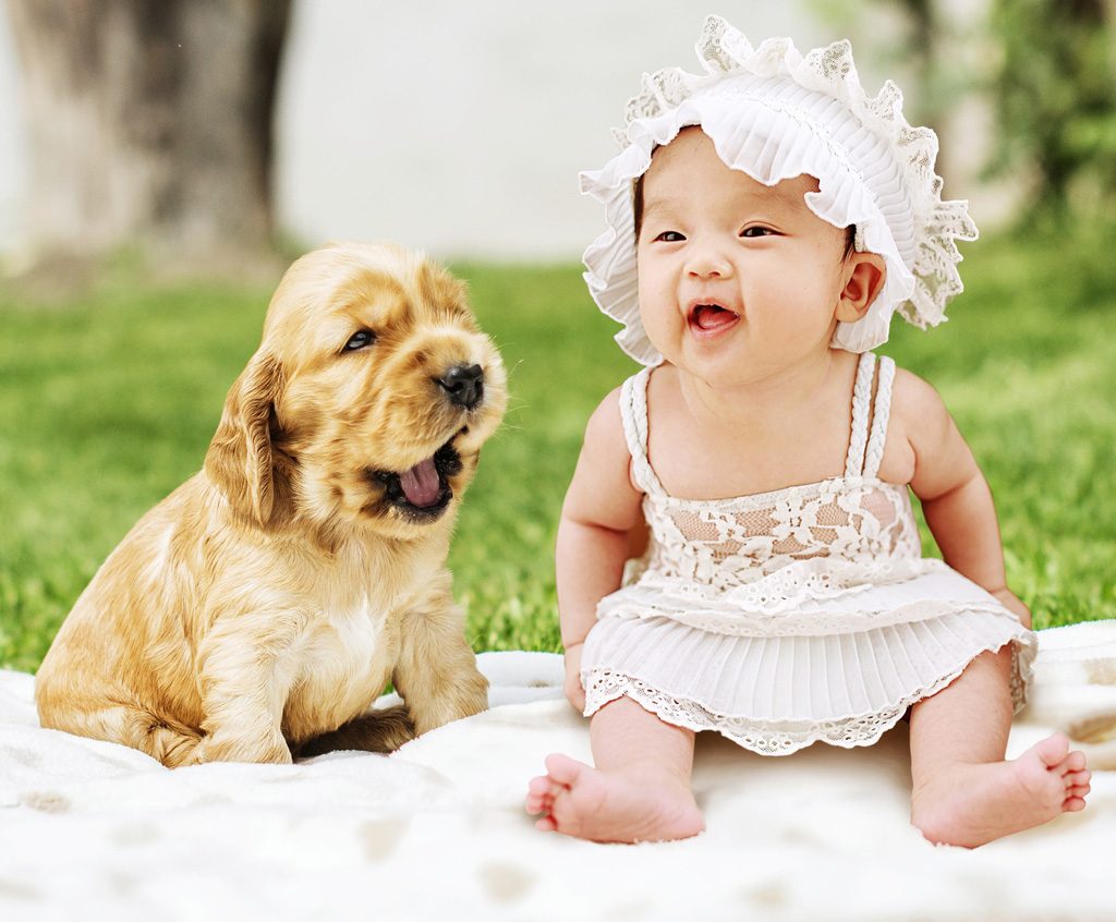 Adorable baby and puppy.