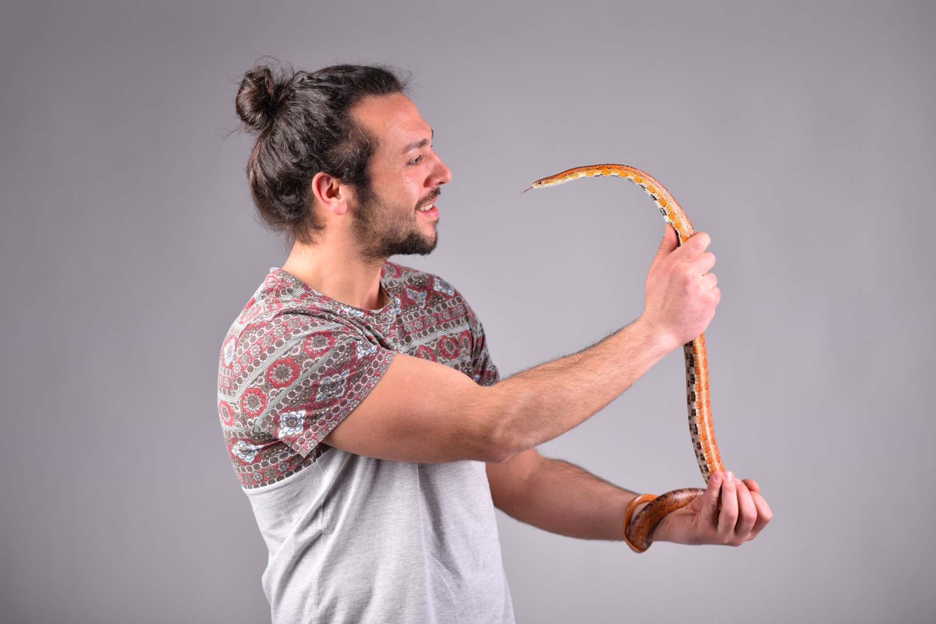 Man holding corn snake