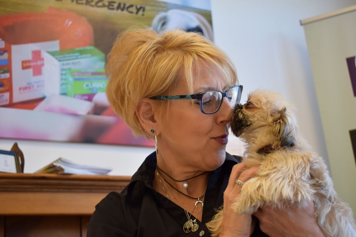 woman and small dog bonding