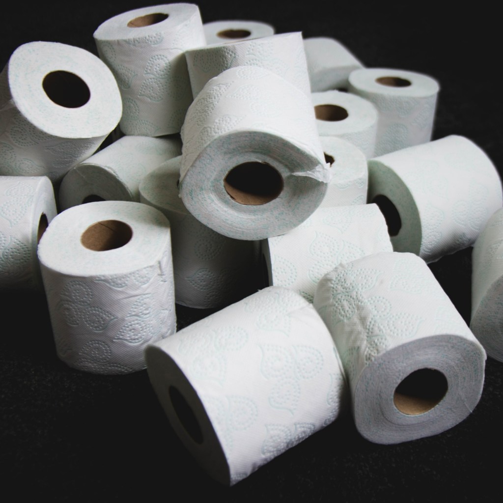 White Tissue Paper Rolls on Black Table