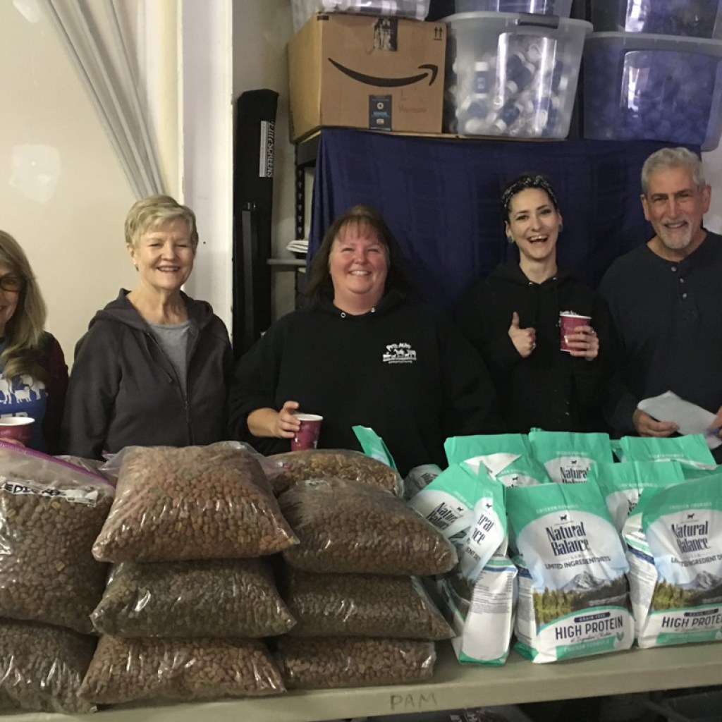 Pet pantry volunteers distributing food to those in need.