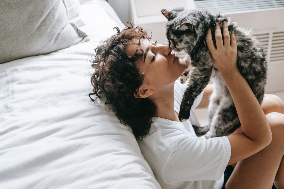 Woman kissing her cat