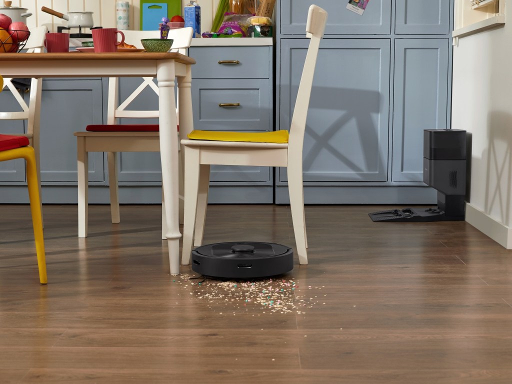 Roborock Q5+ robot vacuum auto cleaning a cereal spill.