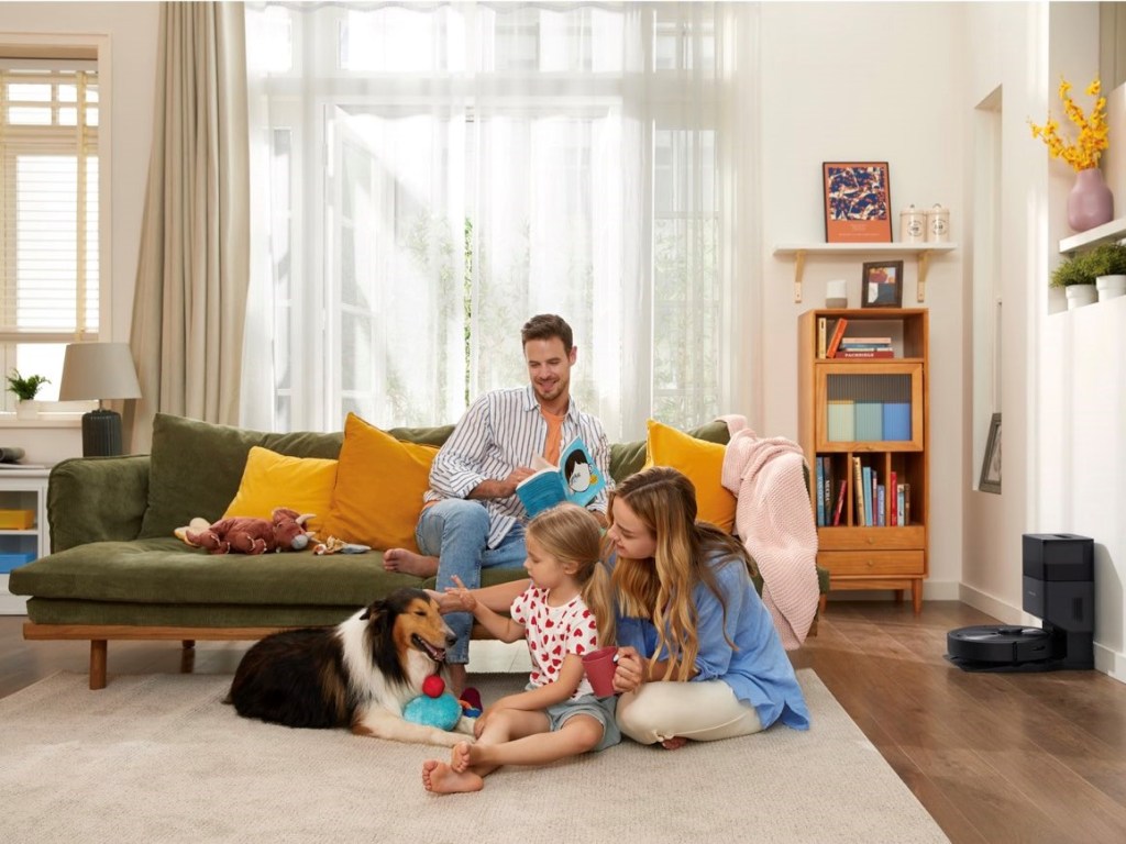 Roborock Q5+ robot vacuum charging during family time.