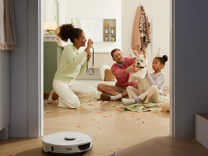 The S7 Max Ultra being used in a home environment with a family looking on at it.