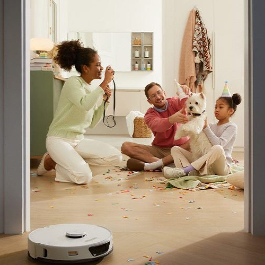The S7 Max Ultra being used in a home environment with a family looking on at it.